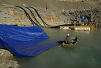 Installing tarp barrier.