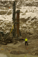 Drilling blast holes.